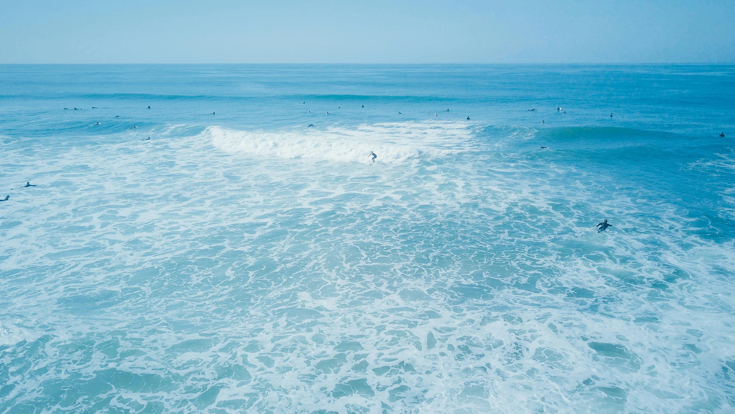 a view of people swimming in the water