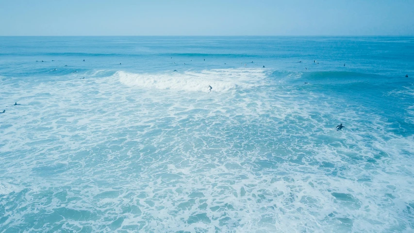 a view of people swimming in the water