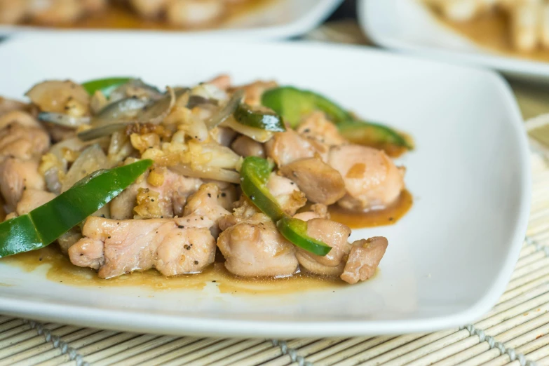 a plate of some sort with mushrooms and soing green