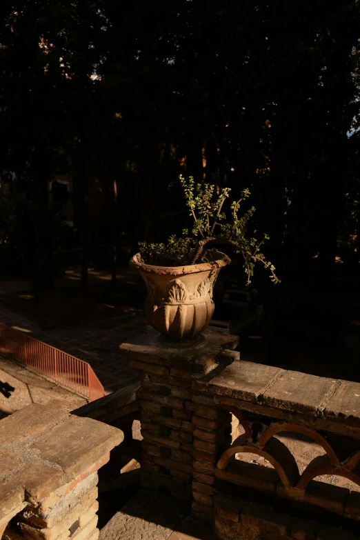 a large planter on top of a stone structure