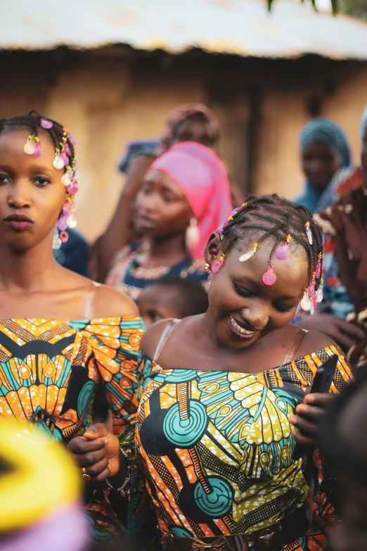 there are many different women dressed in african clothing