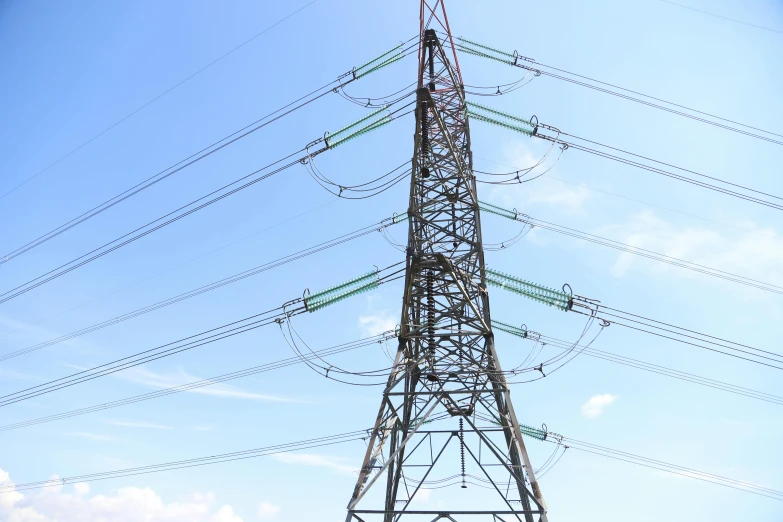 an image of an industrial tower under a blue sky