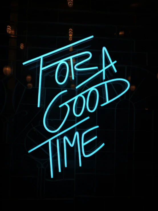 a neon sign for a good time hanging on the wall