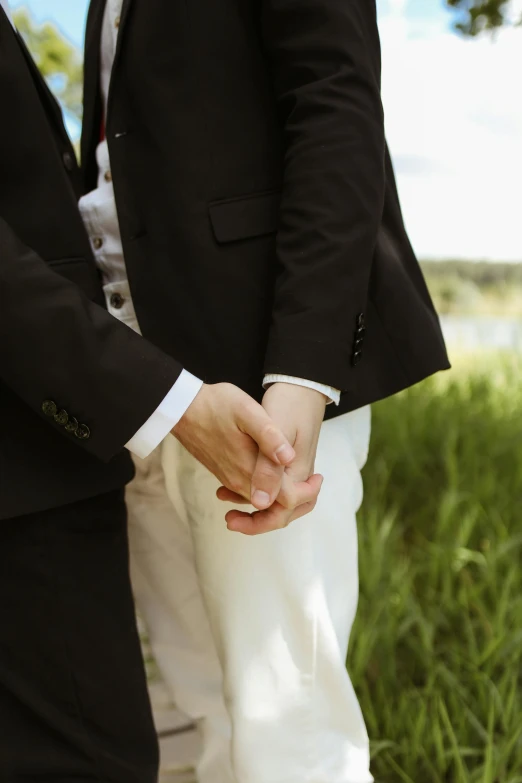 a close up s of a couple holding hands