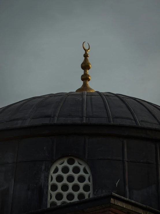 a black and gold dome on top of a building