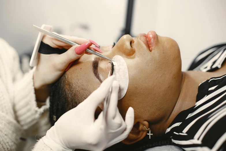 a close up of a person getting a nose lift done