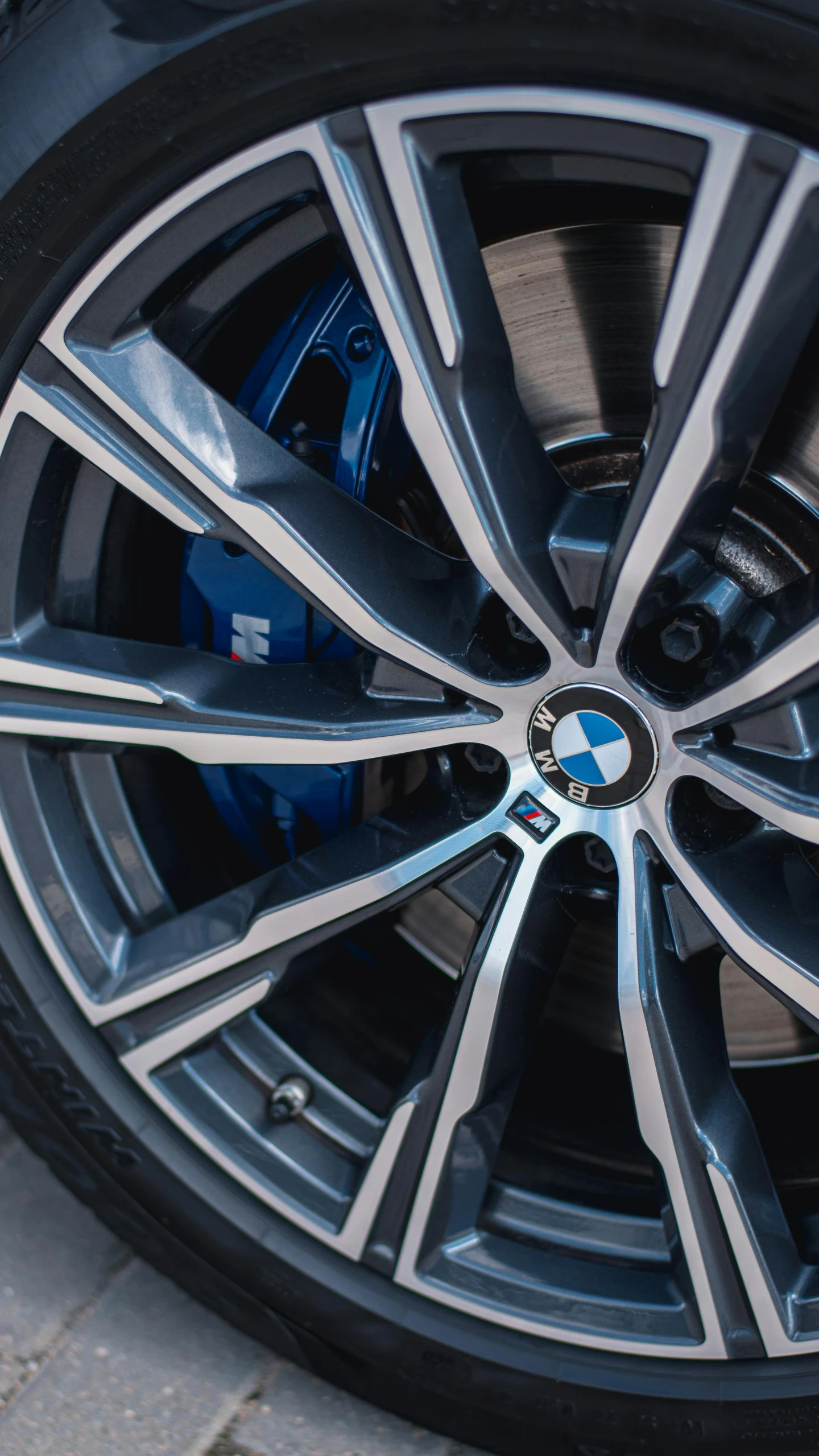 the wheel and tire of a car on the street