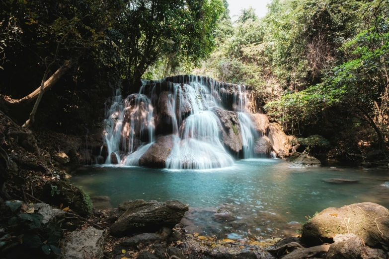 a small waterfall pouring into some water