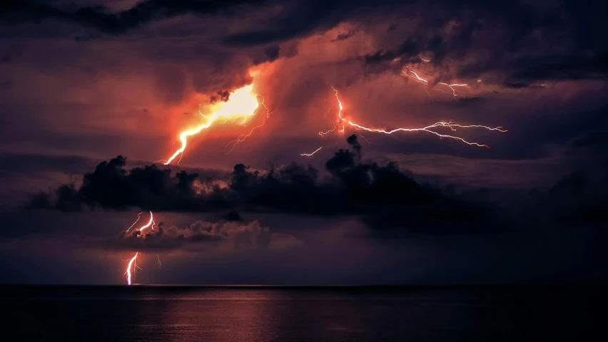 a storm is forming in the sky over the ocean