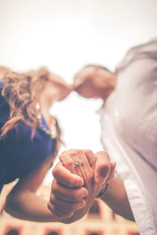 two people pointing hands at each other