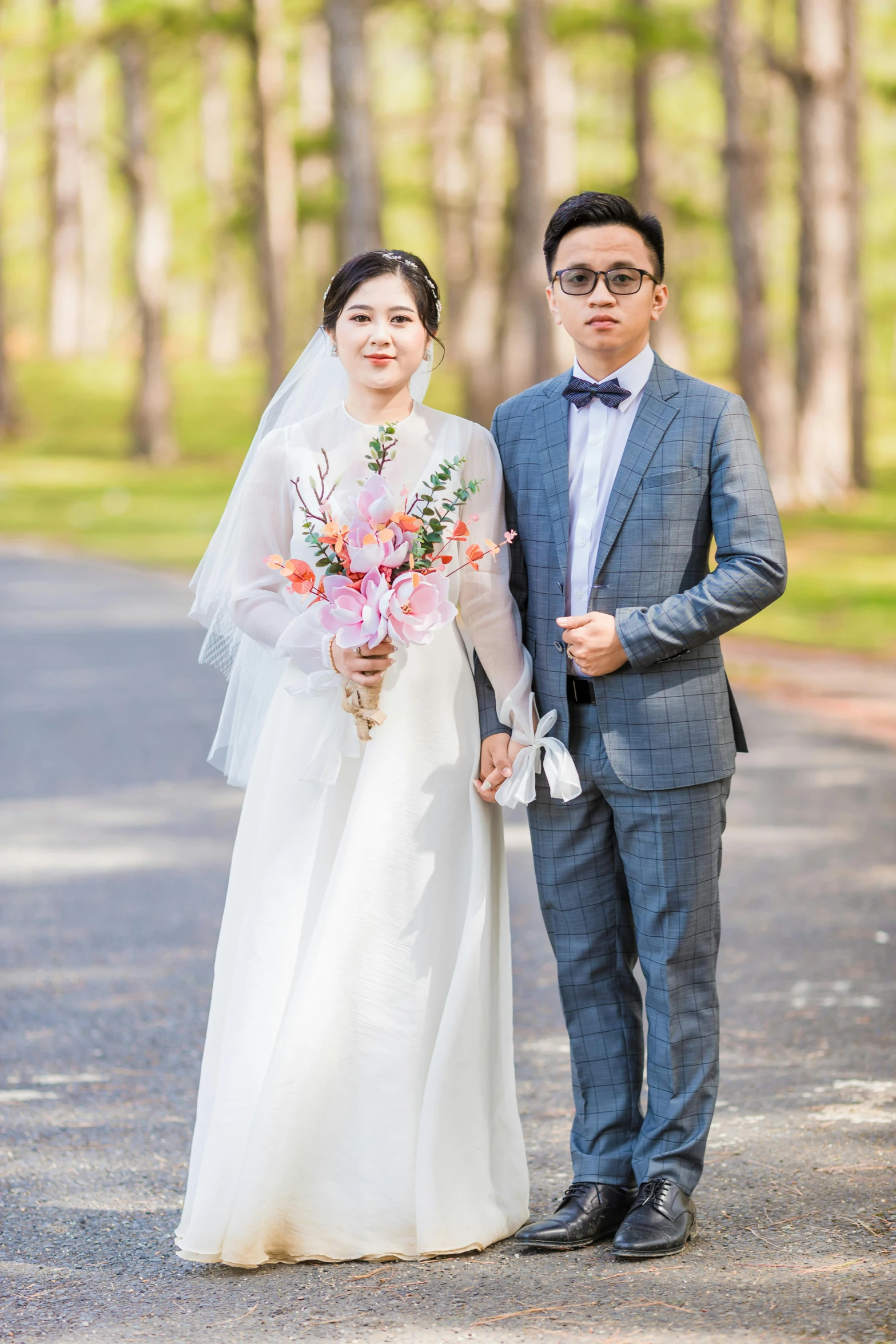 a bride and groom pose for their wedding pograph