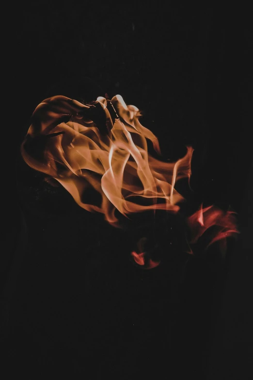 a fire is spinning with red smoke