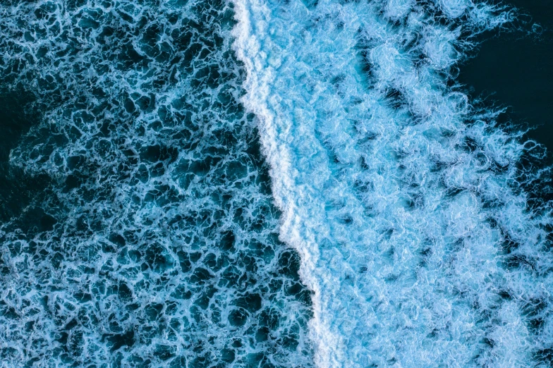 a boat in the middle of the ocean on the water