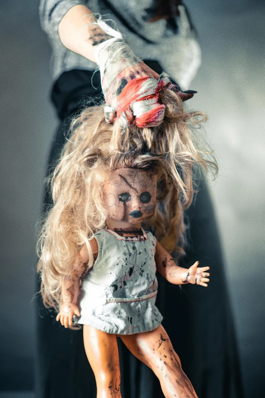 a doll being held up with the same hair