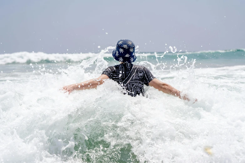 a person riding a surfboard on a wave in the ocean