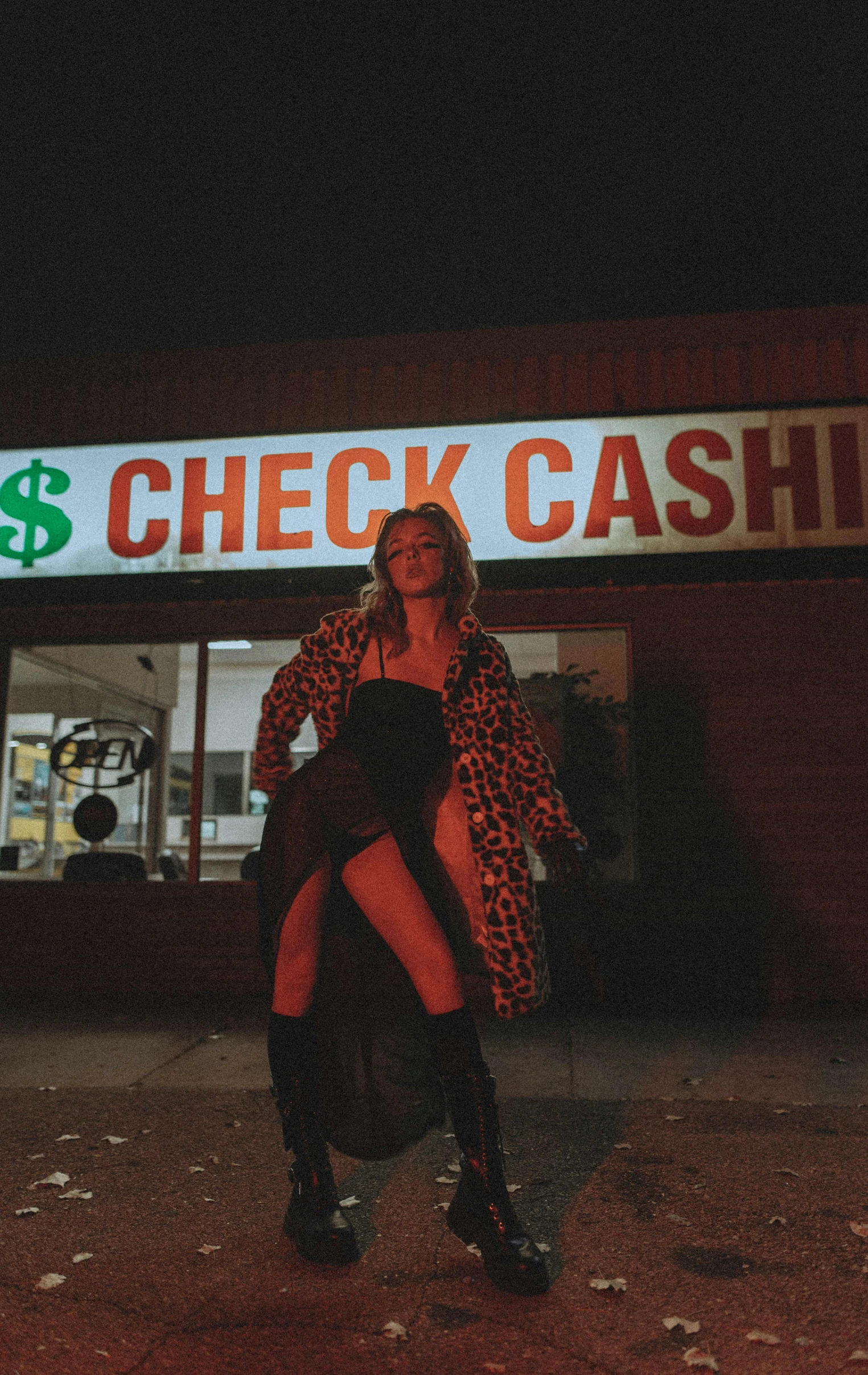 a woman in a leopard coat outside a shop