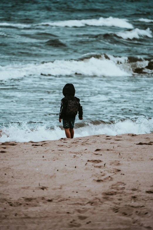 a person with a surfboard in the ocean