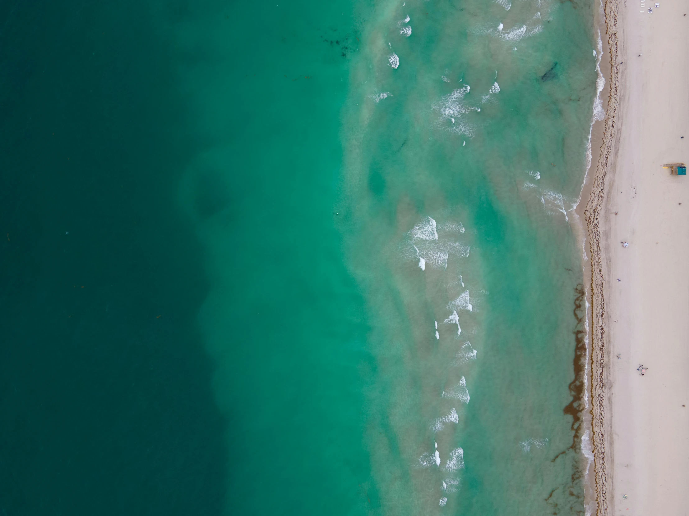 the ocean is green and blue in this aerial view