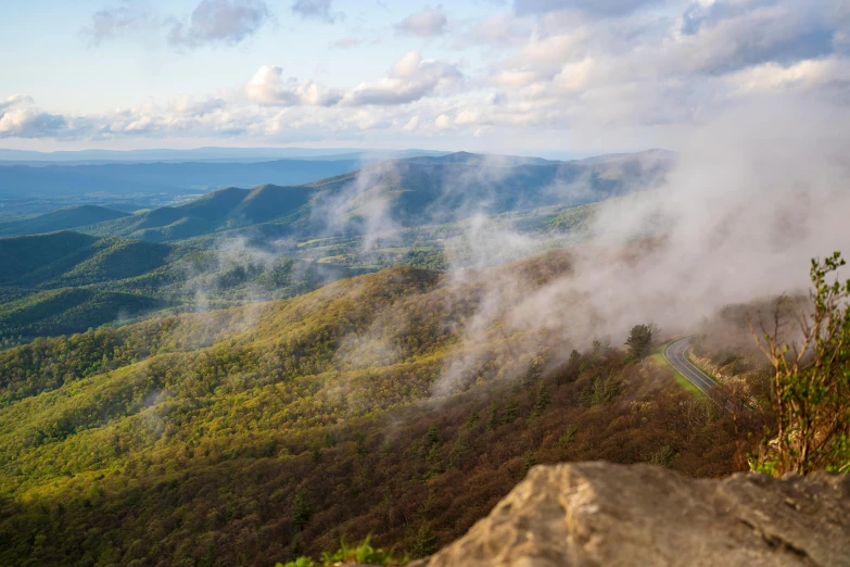 some steam rises from the water that is running down the hill