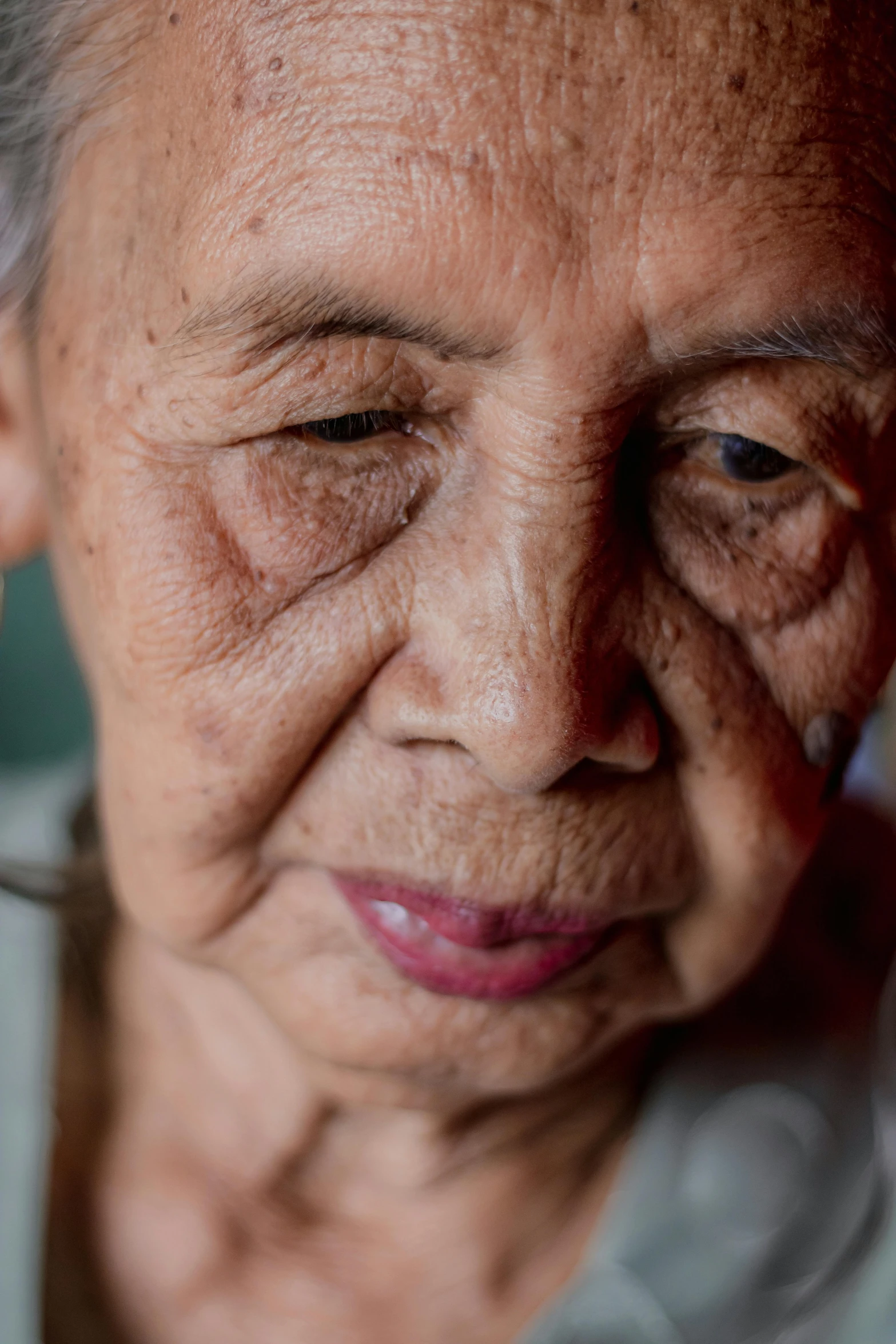 an older woman with wrinkles on her eyes