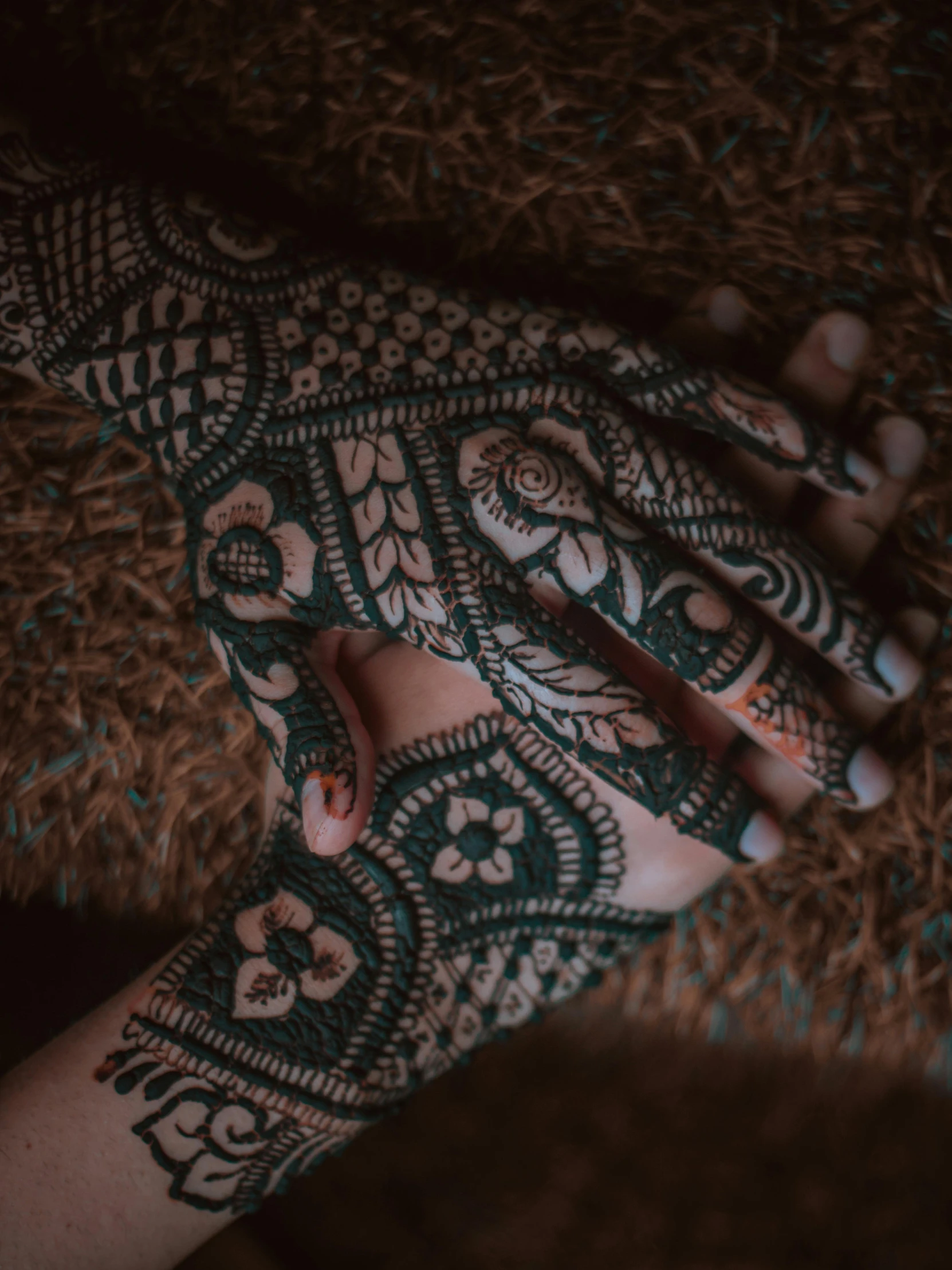 a henna design on the bottom of a woman's foot