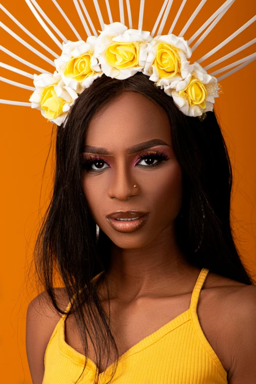 an african american woman is posed with a crown of yellow flowers on her head