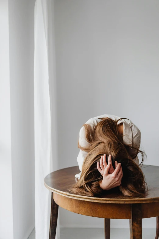 a person laying down on top of a table