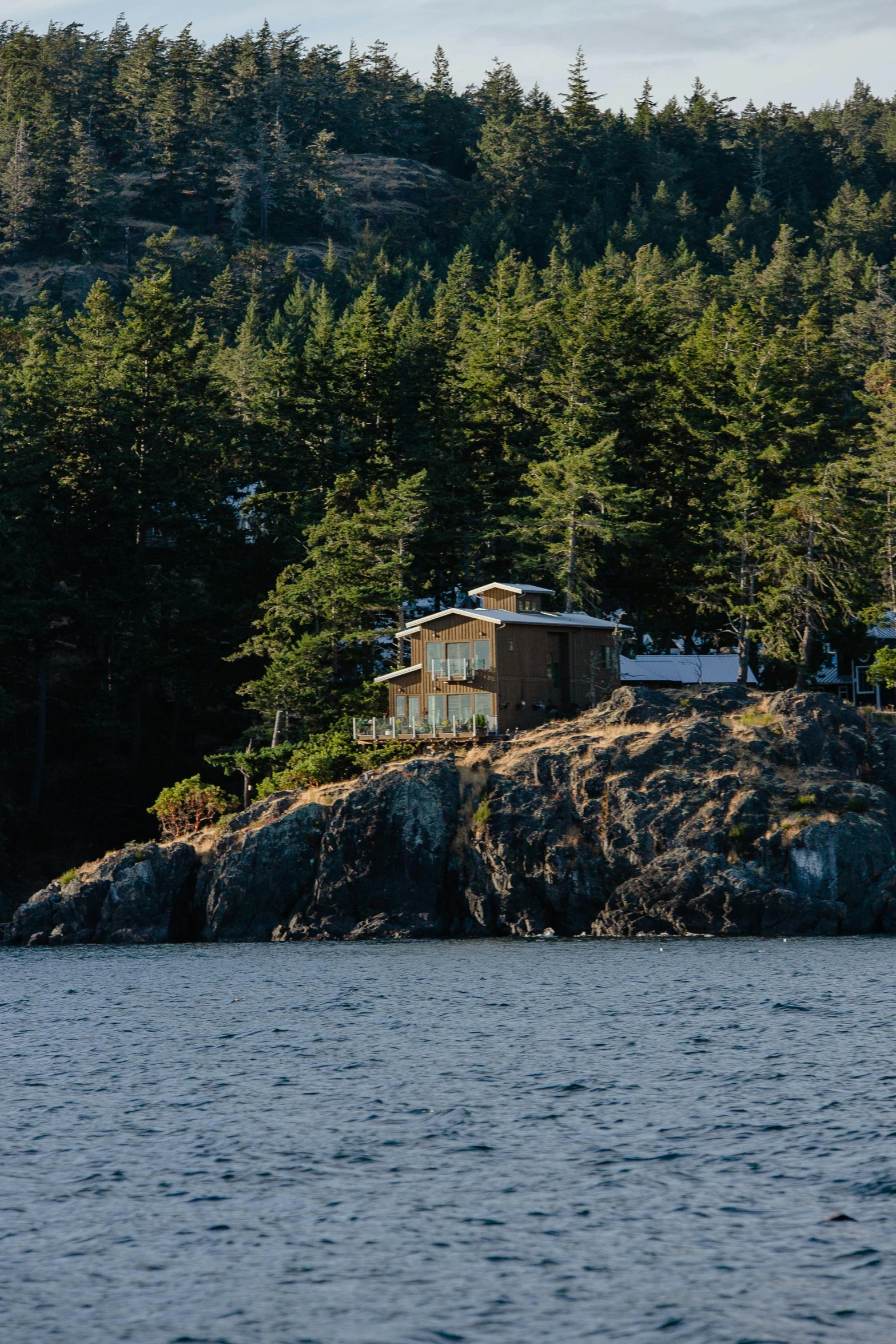 an old building sitting on top of a rocky cliff