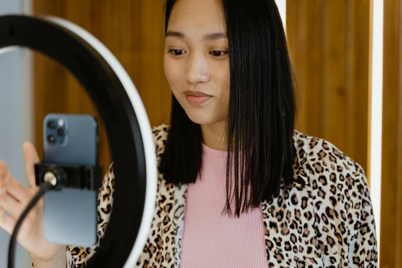 a woman looking at herself in the mirror