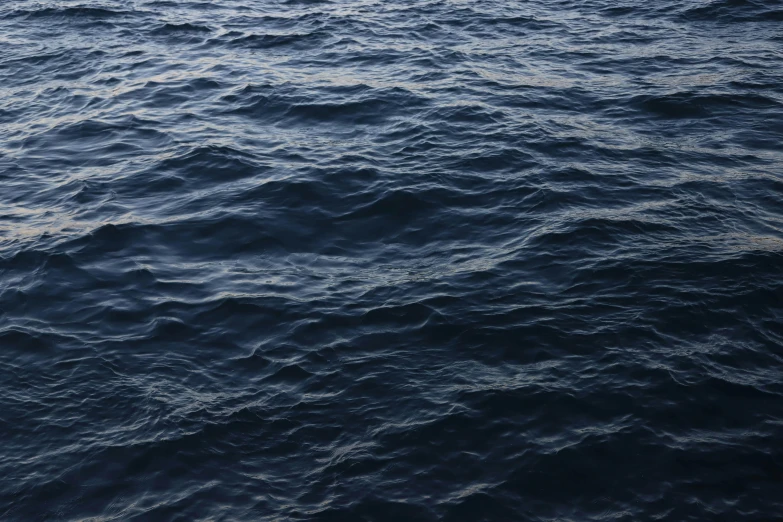 the body of water with many large areas of blue waves