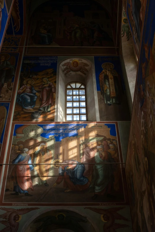 wall of paintings and windows in a church