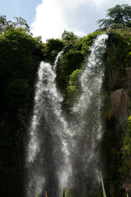 an image of water falling from a waterfall