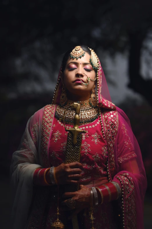 a person in a veil and a costume and jewelry