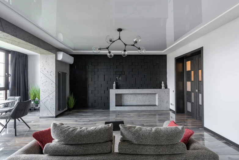 a living room with couches, chairs and chandelier