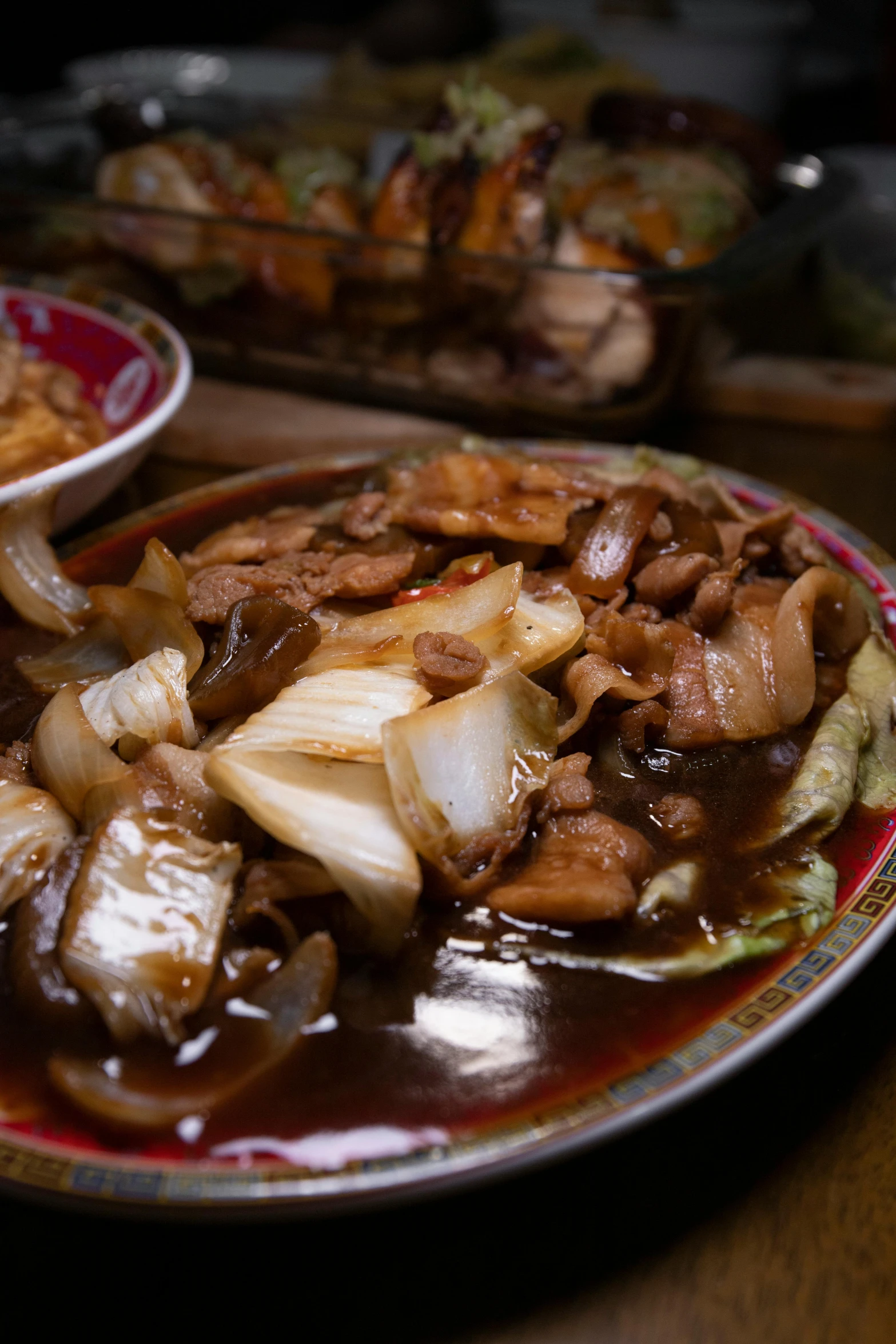 plates of meat and onions covered in sauces