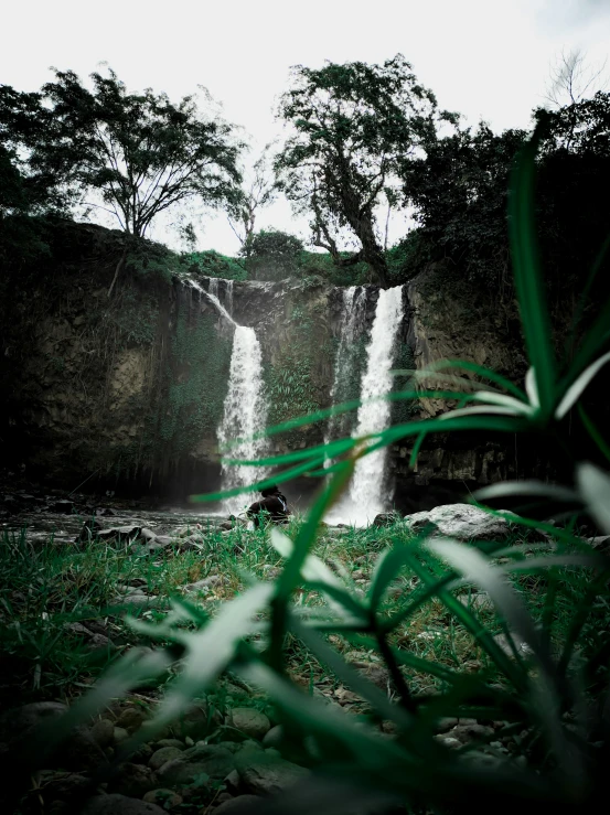 the waterfall is flowing water in the distance