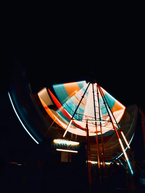 there is a ferris wheel that has some colorful wheels