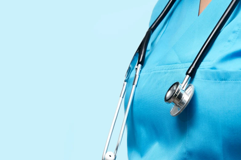 a woman wearing a blue scrubbing uniform and holding a stethoscope