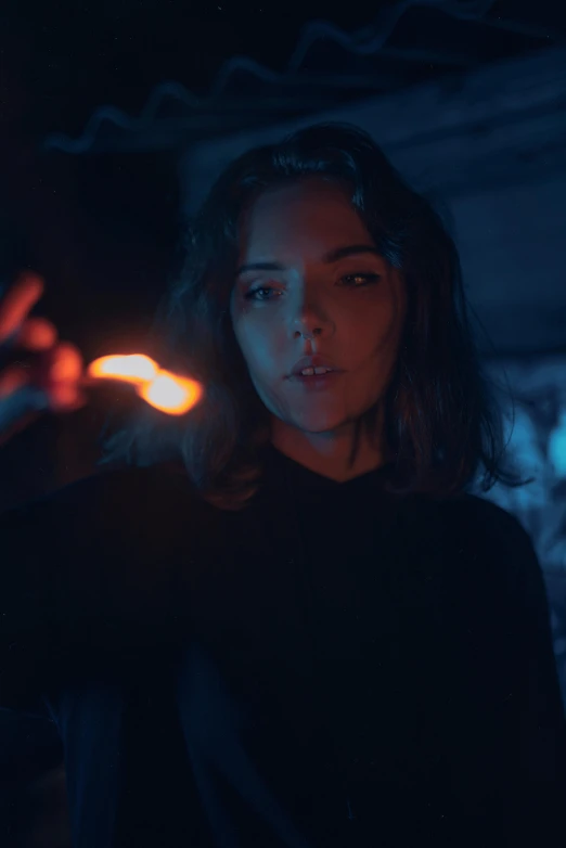 a woman is shown holding a bright red lighter