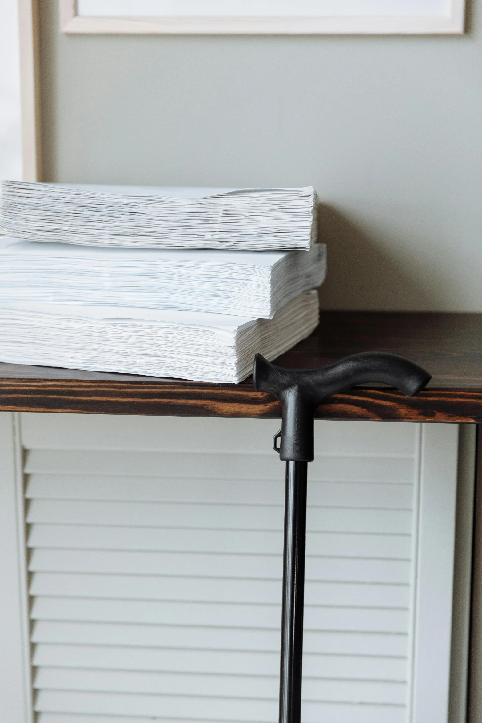 a closed book and black umbrella resting on a table