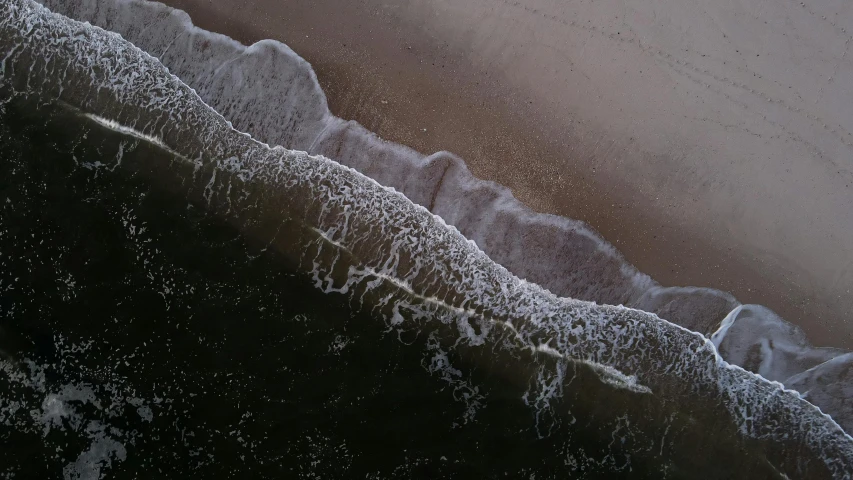 a picture of the water and shore of a beach