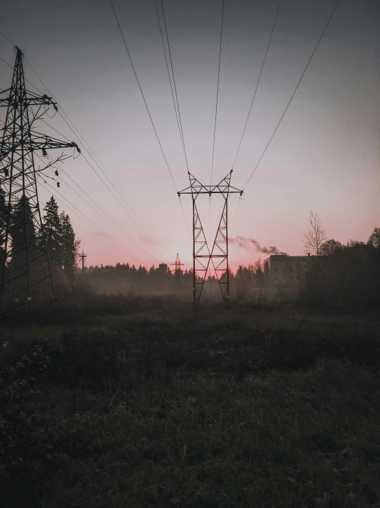 a very dark sky with a lone power line