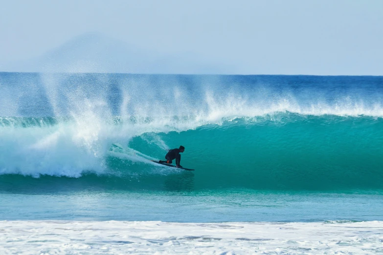 surfer riding a big wave in the ocean