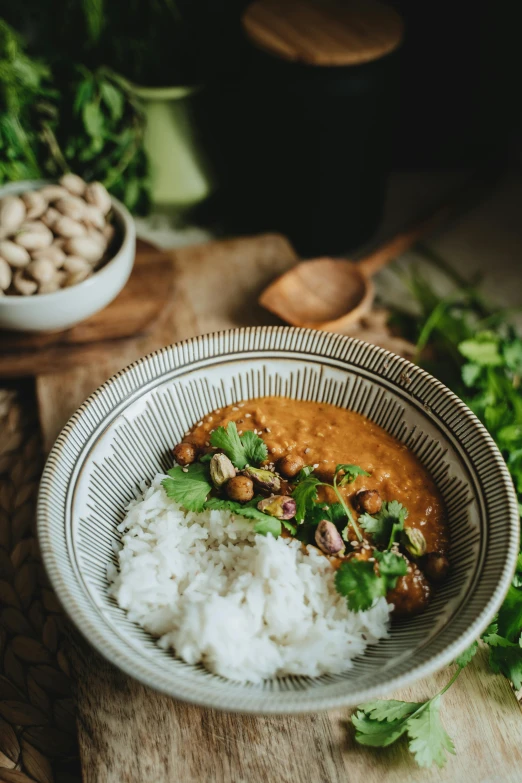 a bowl filled with rice, beans and cilantro