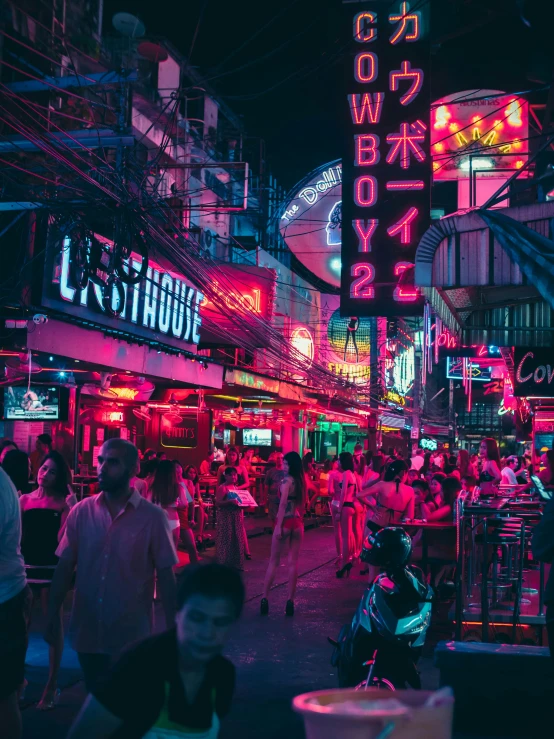 a neon lit city street at night