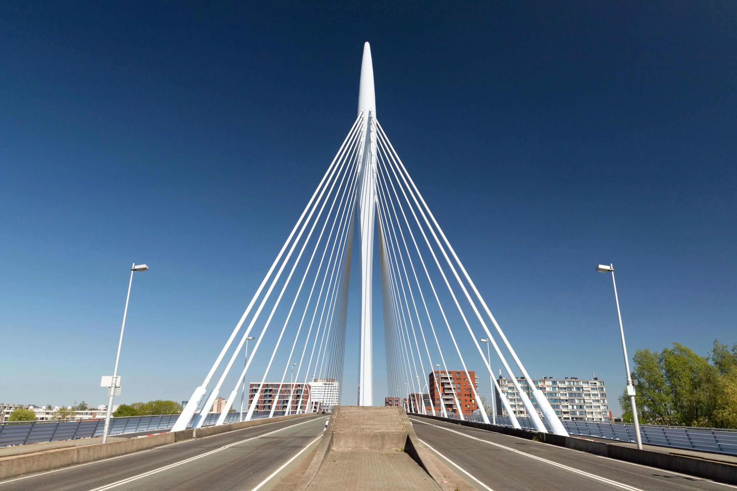 an interesting bridge that has the road and street light in it