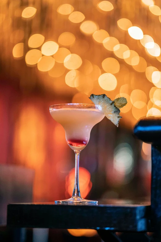 a drink sitting on top of a wooden table