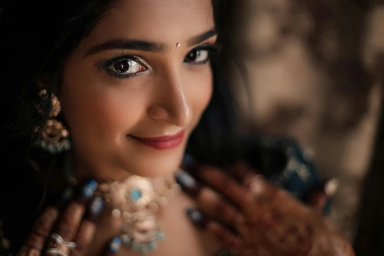 a beautiful woman wearing an ornate celet and jewelry