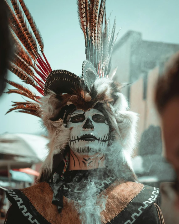 a woman in costume standing outside while smoking soing