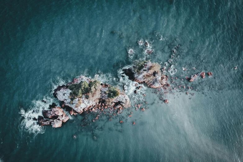 an aerial s of rocks and water